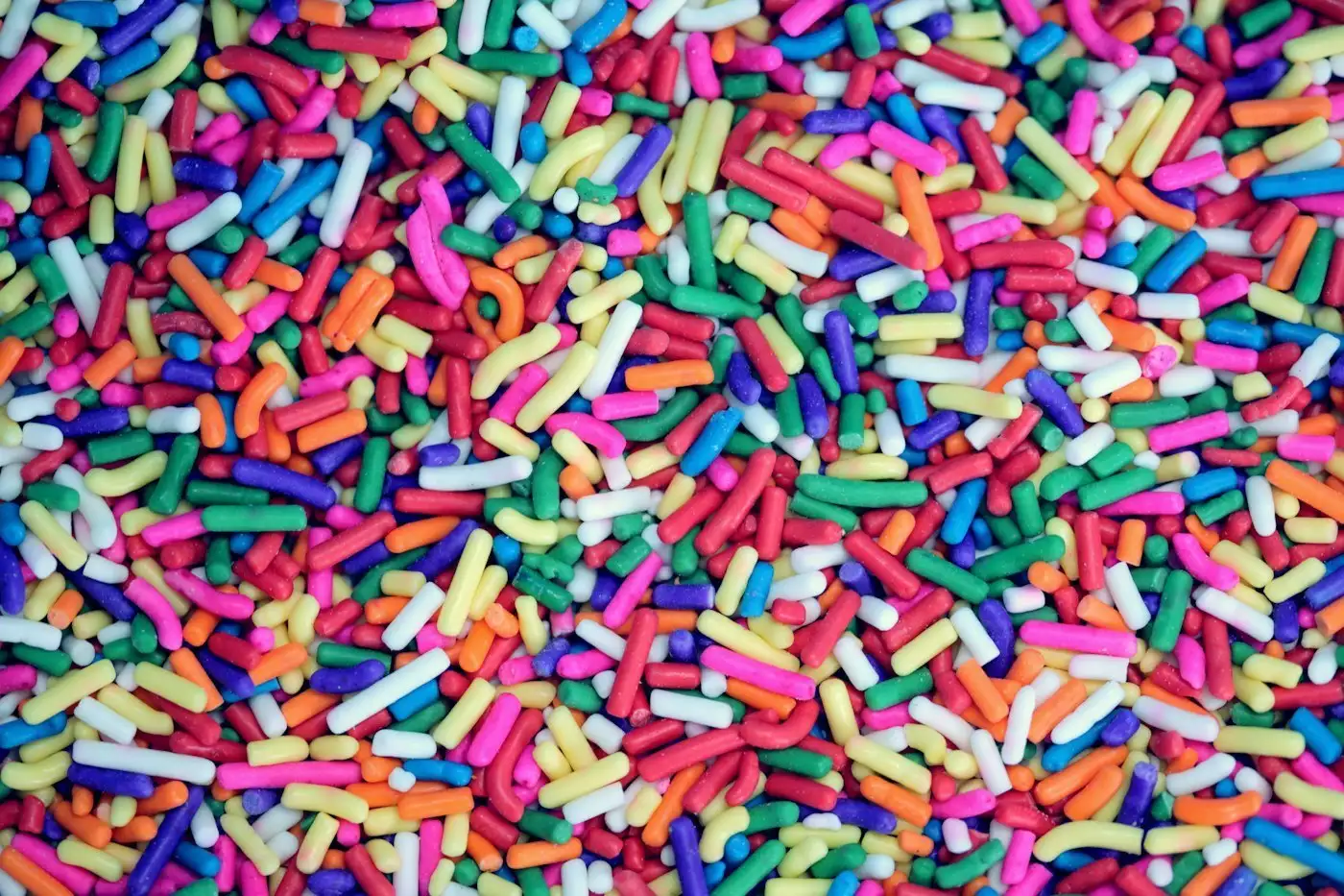 A close-up of bright rainbow sprinkles